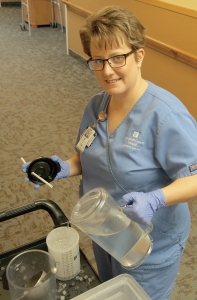 nurse pouring water